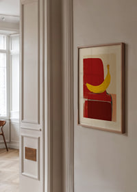 A banana shines against a bold red background, catching the eye immediately-2
