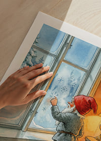 Santa Claus looks out through frosted winter window in warm cabin-9