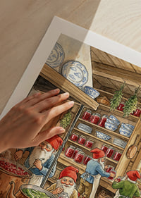 Elves in a kitchen filled with canned goods and copper racks-9