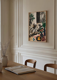 The bike rests in a picturesque garden setting.-2