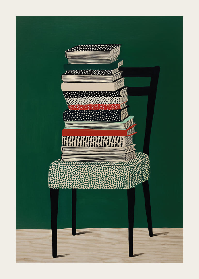 Pile de livres colorés sur une chaise, sur fond vert.-12