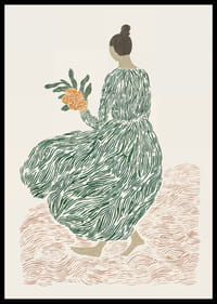 A woman in a green dress holds flowers on a dreamy background.-2