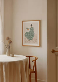 A woman in a green dress holds flowers on a dreamy background.-4