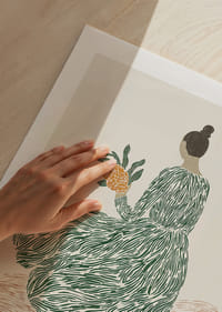 A woman in a green dress holds flowers on a dreamy background.-5