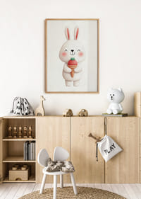 A rabbit with a strawberry ice cream smiles happily.-4