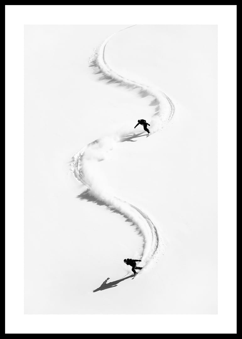 Two skiers meander through the white landscape of snow.-12