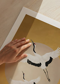 Graceful cranes soar towards a golden horizon.-9