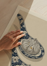 Two dumplings on beautiful spoons harmonize stylishly.-3