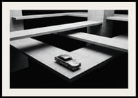 A classic Aston Martin DB5 hovers over the modern concrete landscape.-2