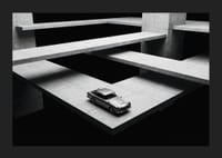 A classic Aston Martin DB5 hovers over the modern concrete landscape.-5