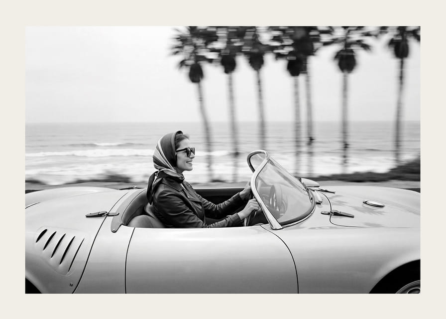 Classic car ride in a Porsche 550 Spyder along the coast gives a sense of freedom and style.-12