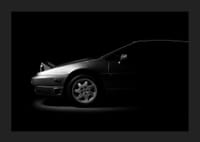 A Lotus Esprit shrouded in shadows exudes dramatic elegance.-1