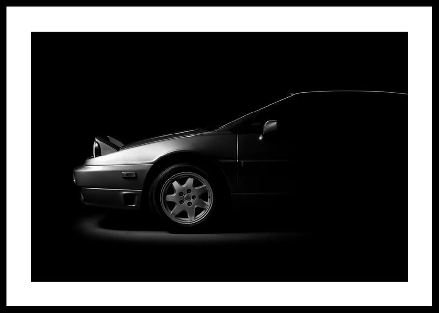 A Lotus Esprit shrouded in shadows exudes dramatic elegance.-12