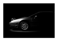 A Lotus Esprit shrouded in shadows exudes dramatic elegance.-3