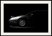 A Lotus Esprit shrouded in shadows exudes dramatic elegance.-4