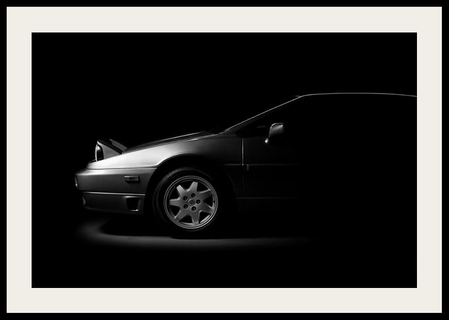 A Lotus Esprit shrouded in shadows exudes dramatic elegance.-12