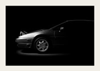 A Lotus Esprit shrouded in shadows exudes dramatic elegance.-5