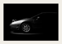 A Lotus Esprit shrouded in shadows exudes dramatic elegance.-5