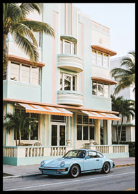 An iconic Porsche 911 in front of a pastel building creates nostalgia.-6