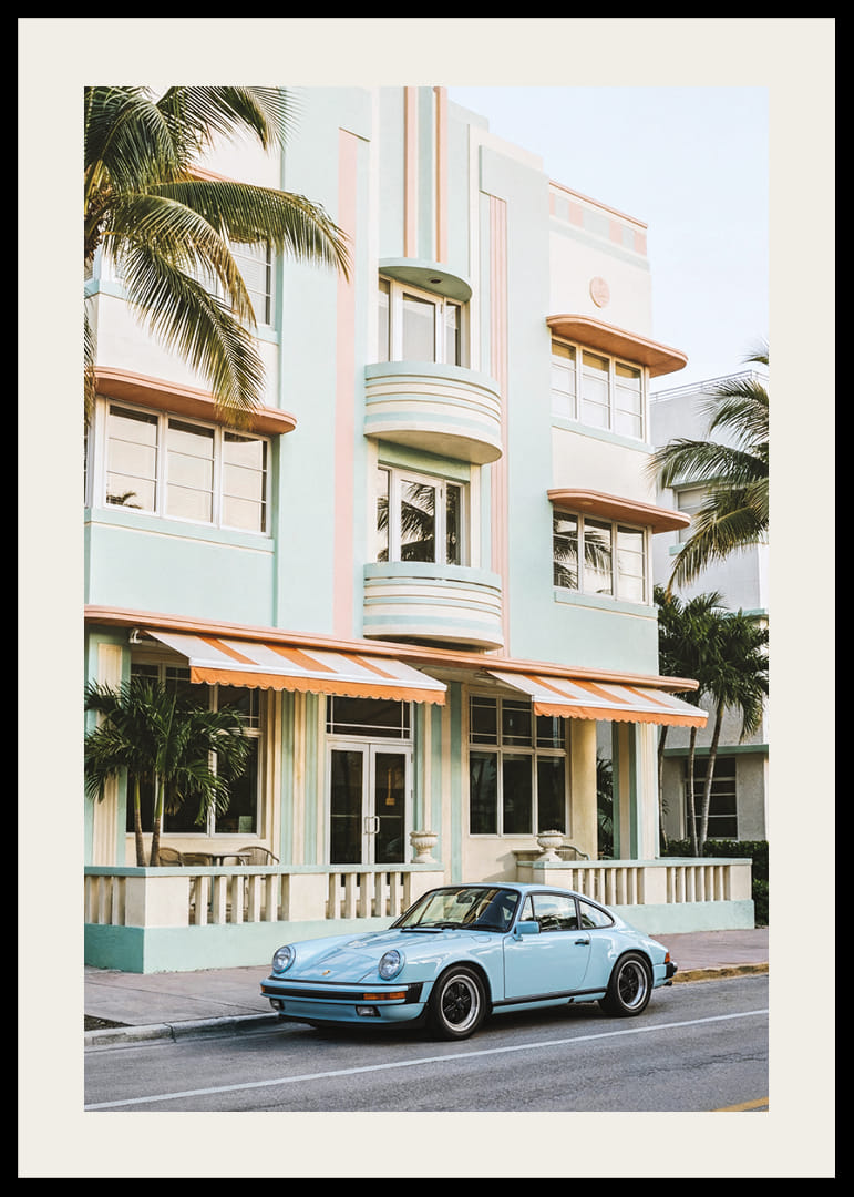 An iconic Porsche 911 in front of a pastel building creates nostalgia.-12