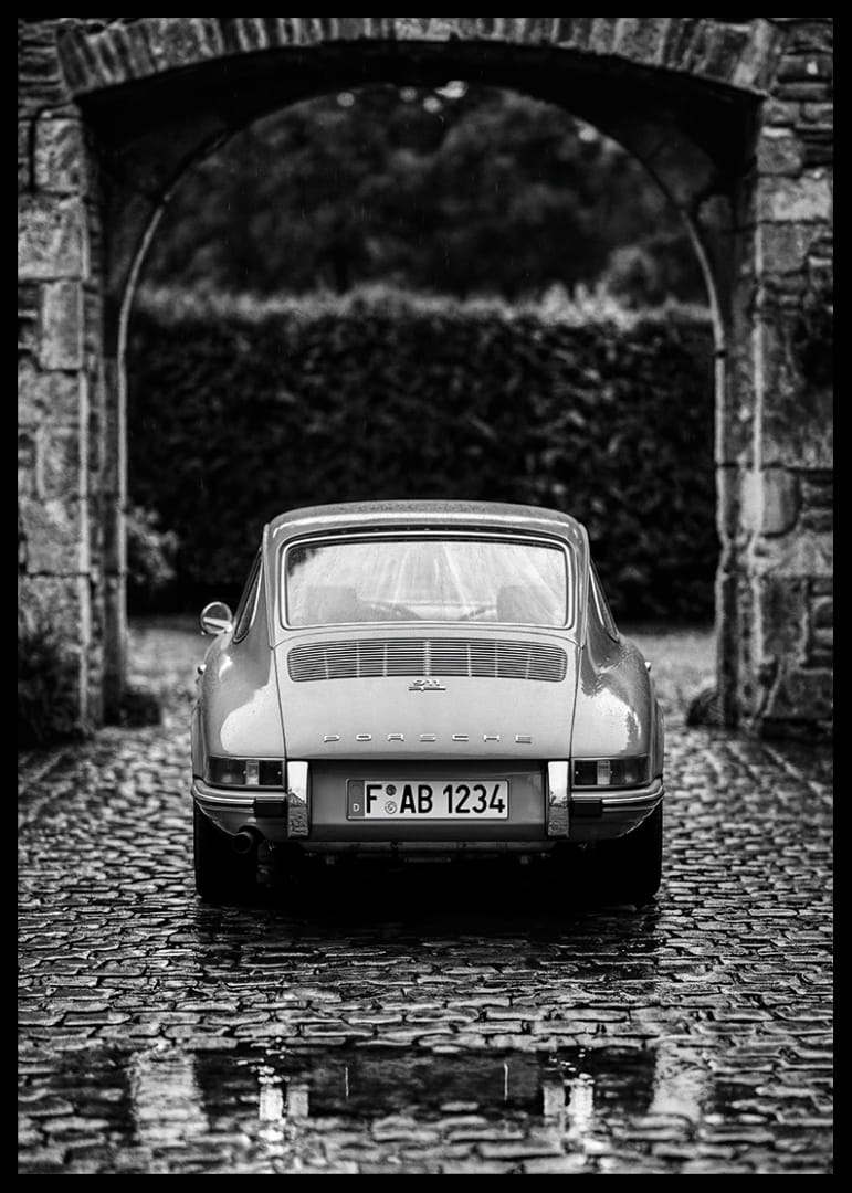 A classic Porsche 911 in a rainy landscape gives a nostalgic feeling.-12
