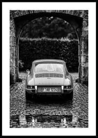 A classic Porsche 911 in a rainy landscape gives a nostalgic feeling.-0