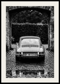 A classic Porsche 911 in a rainy landscape gives a nostalgic feeling.-2