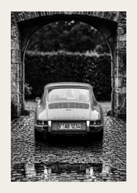 A classic Porsche 911 in a rainy landscape gives a nostalgic feeling.-3