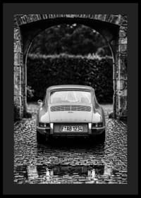 A classic Porsche 911 in a rainy landscape gives a nostalgic feeling.-4