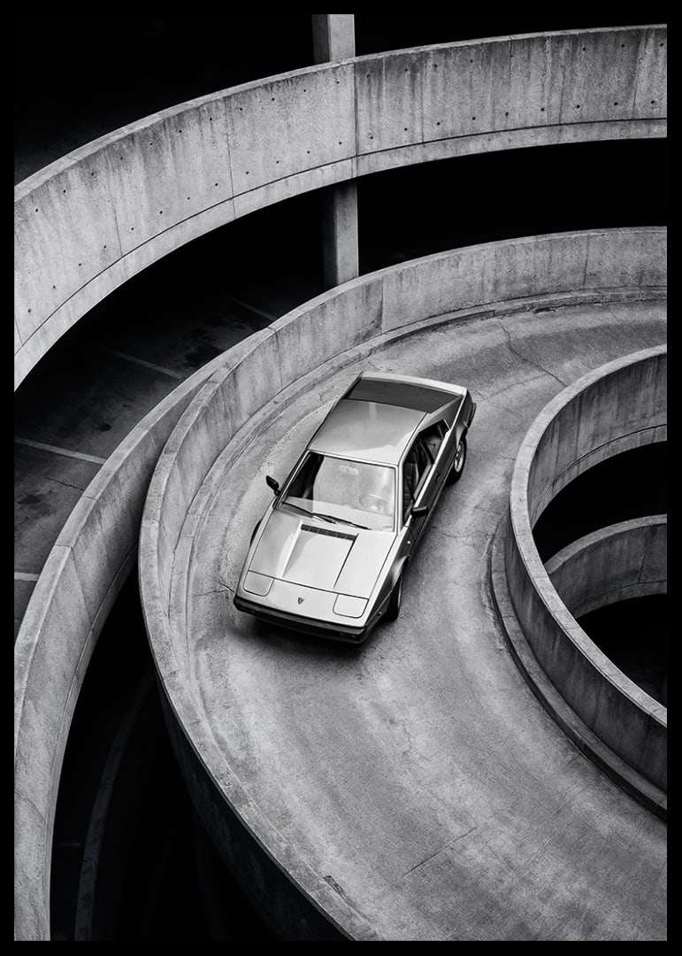 A Lamborghini Jalpa car sweeps through a spiraling concrete road in elegant style.-12