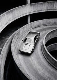 A Lamborghini Jalpa car sweeps through a spiraling concrete road in elegant style.-7
