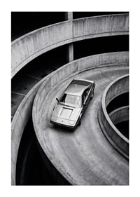 A Lamborghini Jalpa car sweeps through a spiraling concrete road in elegant style.-1