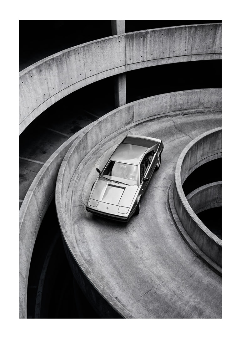 A Lamborghini Jalpa car sweeps through a spiraling concrete road in elegant style.-12