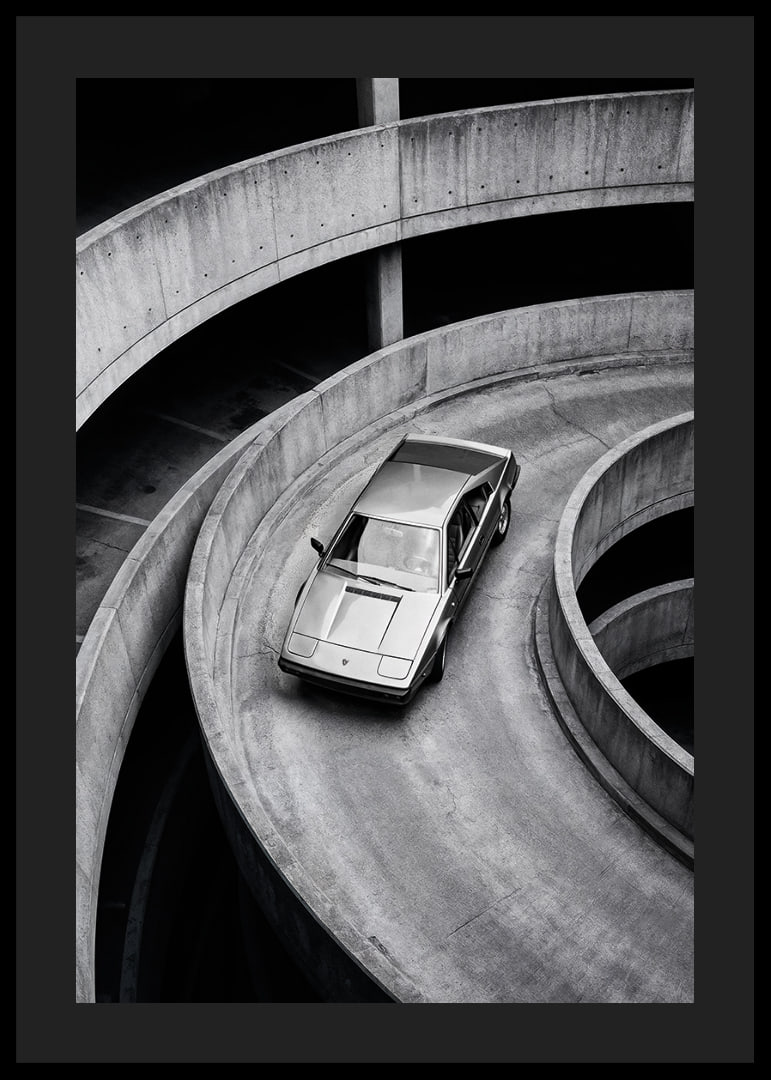 A Lamborghini Jalpa car sweeps through a spiraling concrete road in elegant style.-12