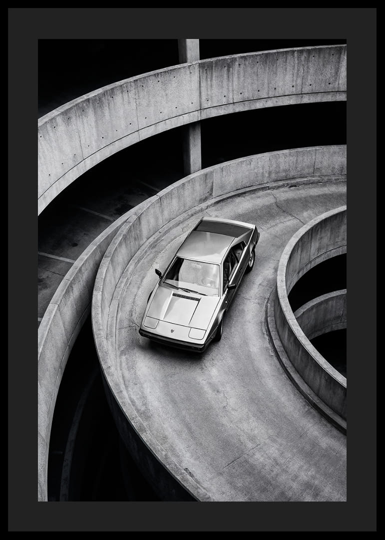 A Lamborghini Jalpa car sweeps through a spiraling concrete road in elegant style.-12
