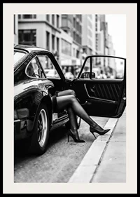 Elegant legs extend from a Porsche 911 in an urban setting.-2