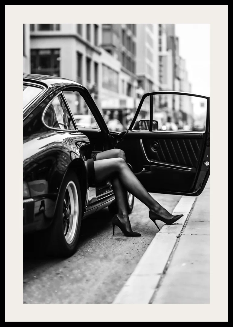 Elegant legs extend from a Porsche 911 in an urban setting.-12