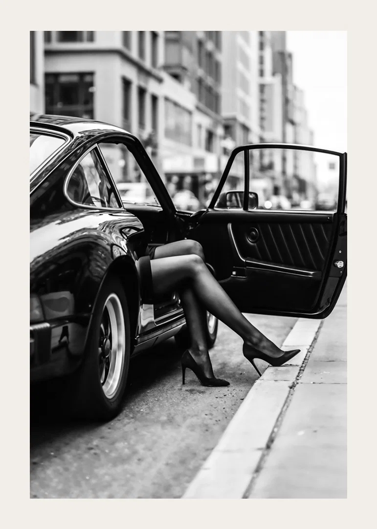 Elegant legs extend from a Porsche 911 in an urban setting.-12