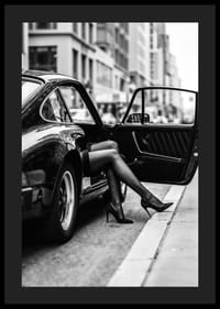Elegant legs extend from a Porsche 911 in an urban setting.-4
