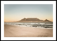 Tranquil coastline with a majestic mountain at sunset.-2