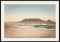 Tranquil coastline with a majestic mountain at sunset.-4