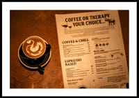 A hot cup of coffee alongside an engaging menu selection.-2