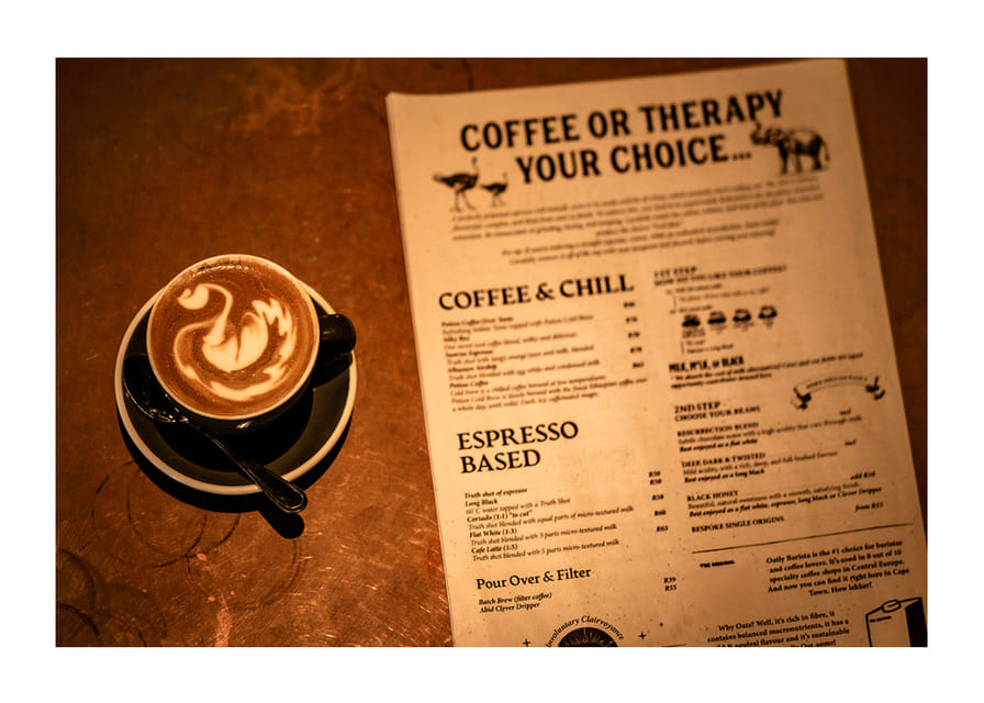 A hot cup of coffee alongside an engaging menu selection.-12