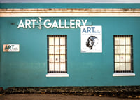 A vibrant turquoise facade attracts visitors to the world of creativity.-7