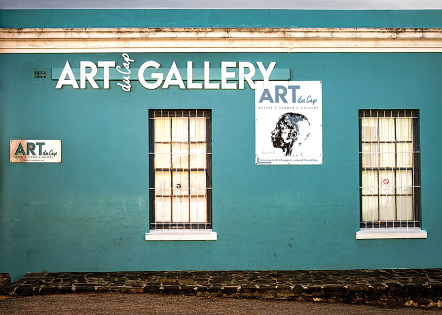 A vibrant turquoise facade attracts visitors to the world of creativity.-12