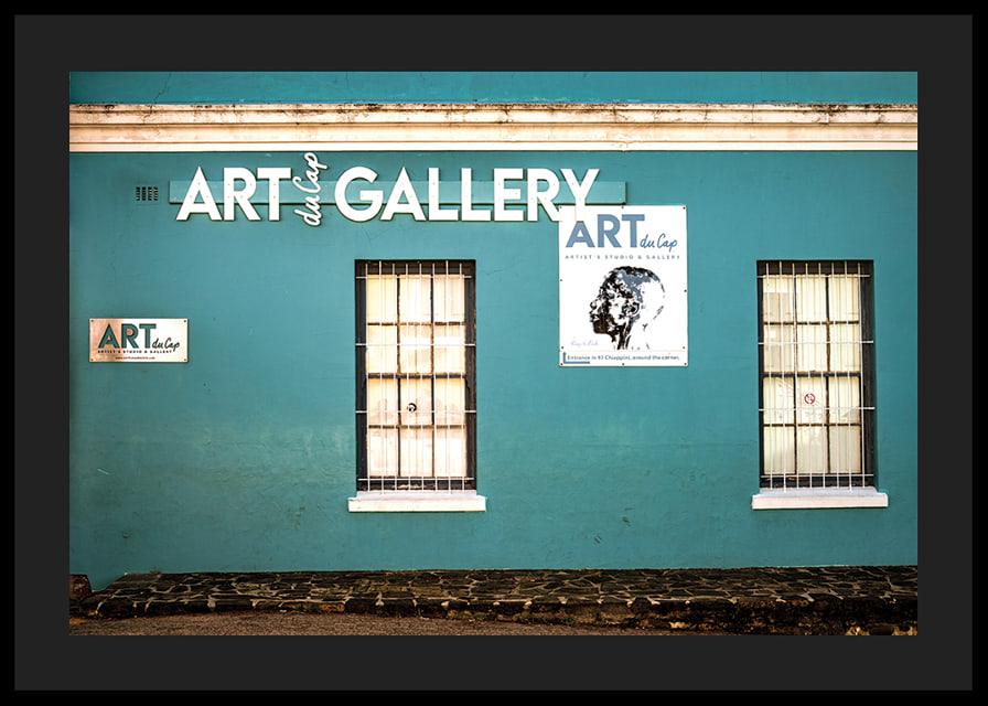 A vibrant turquoise facade attracts visitors to the world of creativity.-12
