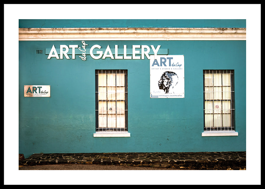 A vibrant turquoise facade attracts visitors to the world of creativity.-12