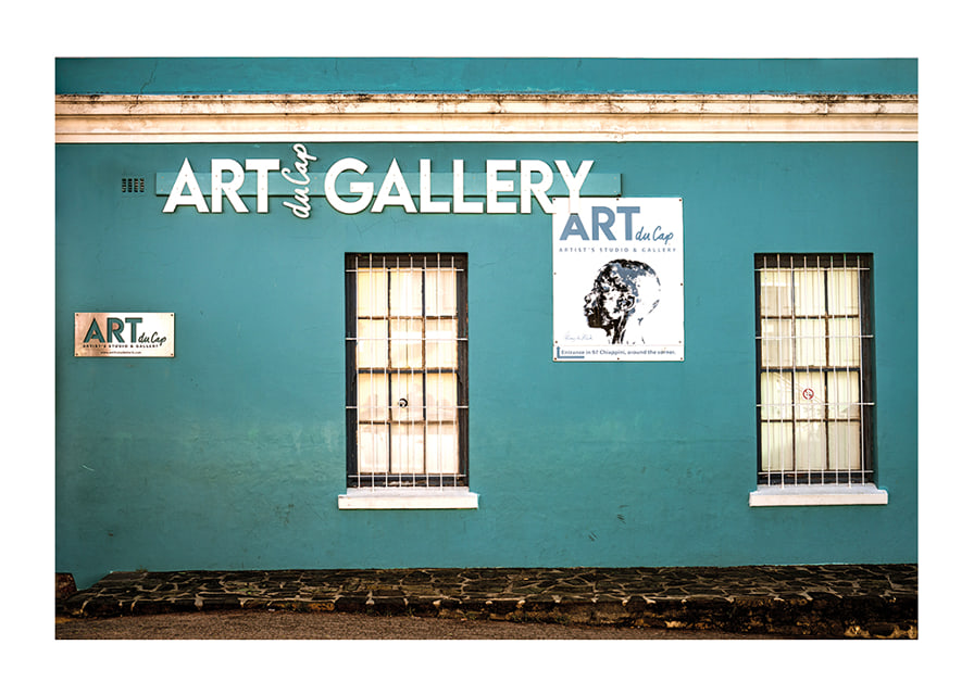A vibrant turquoise facade attracts visitors to the world of creativity.-12