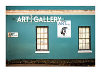 A vibrant turquoise facade attracts visitors to the world of creativity.-3