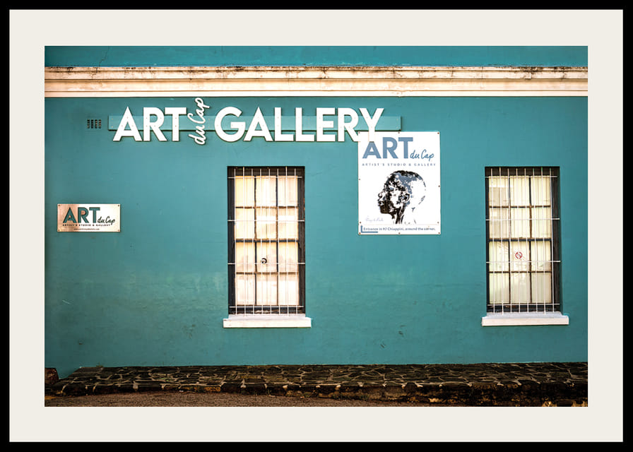 A vibrant turquoise facade attracts visitors to the world of creativity.-12